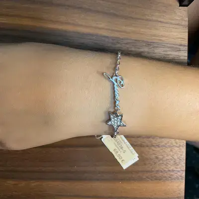 Joya Guess Pulsera plateada con estrella de circonitas